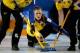 RIGA, LATVIA - MARCH 24: Christina Bertrup (C) of Sweden throws a stone as Maria Prytz (L) and Maria Wennerstrom (R) sweep during the Gold Medal match between Scotland and Sweden on Day 9 of the Titlis Glacier Mountain World Women's Curling Championship