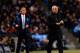 MANCHESTER, ENGLAND - FEBRUARY 03: Manuel Pellegrini manager of Manchester City and Jose Mourinho manager of Chelsea give instructions during the Barclays Premier League match between Manchester City and Chelsea at Etihad Stadium on February 3, 2014 in Ma