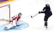 SOCHI, RUSSIA - FEBRUARY 15: T.J. Oshie #74 of the United States scores on a shootout against Sergei Bobrovski #72 of Russia during the Men's Ice Hockey Preliminary Round Group A game on day eight of the Sochi 2014 Winter Olympics at Bolshoy Ice Dome on