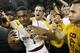 TEMPE, AZ - FEBRUARY 14: Jahii Carson #1 of the Arizona State Sun Devils is embraced by students in celebration of a 69-66 double overtime victory over the Arizona Wildcats during a college basketball game at Wells Fargo Arena on February 14, 2014 in Tem