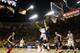 TEMPE, AZ - FEBRUARY 14: Jahii Carson #1 of the Arizona State Sun Devils drives to the basket as T.J. McConnell #4 of the Arizona Wildcats defends during the first half of a college basketball game at Wells Fargo Arena on February 14, 2014 in Tempe, Ariz