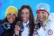 SOCHI, RUSSIA - FEBRUARY 13: (L-R) Silver medalist Charlotte Kalla of Sweden, gold medalist Justyna Kowalczyk of Poland and bronze medalist Therese Johaug of Norway celebrate during the medal ceremony for the Women's 10 km Classic on day six of the Sochi