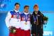 SOCHI, RUSSIA - FEBRUARY 15: (L-R) Silver medalist Vladimir Grigorev of Russia, gold medalist Victor An of Russia and bronze medalist Sjinkie Knegt of the Netherlands on the podium during the medal ceremony for Short Track Speed Skating Menfs 1000m on d