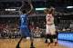 Dec 16, 2013; Chicago, IL, USA; Chicago Bulls shooting guard Jimmy Butler (21) is defended by Orlando Magic shooting guard Victor Oladipo (5) during the first quarter at the United Center. Mandatory Credit: Rob Grabowski-USA TODAY Sports