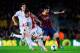 BARCELONA, SPAIN - FEBRUARY 15: Lionel Messi of FC Barcelona duels for the ball with Saul Niguez of Rayo Vallecano during the La Liga match between FC Barcelona and Rayo Vallecano de Madrid at Camp Nou on February 15, 2014 in Barcelona, Spain. (Photo by