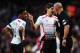 LONDON, ENGLAND - FEBRUARY 16: Raheem Sterling (L) and Steven Gerrard (C) of Liverpool talk with match referee Howard Webb during the FA Cup Fifth Round match between Arsenal and Liverpool at the Emirates Stadium on February 16, 2014 in London, England.