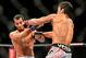 Feb 15, 2014; Jaragua do Sul, SC, Brazil; Lyoto Machida (red gloves) fights against Gegard Mousasi (blue gloves) during UFC Fight Night Machida vs Mousasi at Arena Jaragua. Mandatory Credit: Jason Silva-USA TODAY Sports