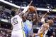 INDIANAPOLIS, IN - FEBRUARY 10: Kenneth Faried #35 of the Denver Nuggets shoots the ball while defended by Roy Hibbert #55 and David West #21 of the Indiana Pacers at Bankers Life Fieldhouse on February 10, 2014 in Indianapolis, Indiana. NOTE TO USER: U