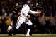 COLUMBIA, MO - NOVEMBER 30: Quarterback Johnny Manziel #2 of the Texas A&M Aggies scrambles as defensive lineman Harold Brantley #90 of the Missouri Tigers chases during the game on November 30, 2013 in Columbia, Missouri. (Photo by Jamie Squire/Getty I
