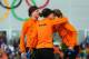 SOCHI, RUSSIA - FEBRUARY 16: (L-R) Gold medalist Jorien ter Mors of the Netherlands, silver medalist Ireen Wust of the Netherlands and bronze medalist Lotte van Beek of the Netherlands on the podium during the flower ceremony for the Speed Skating Women'