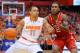 SYRACUSE, NY - FEBRUARY 15: Tyler Ennis #11 of the Syracuse Orange drives to the basket against the defense of Anthony Barber #2 of the North Carolina State Wolfpack during the first half at the Carrier Dome on February 15, 2014 in Syracuse, New York. (