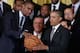 WASHINGTON, DC - JANUARY 14: National Basketball Association 2012-2013 champion Miami Heat player Chris Bosh (L) presents President Barack Obama with a signed basketball during an event at the White House January 14, 2014 in Washington, DC. This is the s