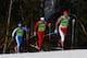 SOCHI, RUSSIA - FEBRUARY 16: (R-L) Chris Andre Jespersen of Norway, Jonas Baumann of Switzerland and Giorgio di Centa of Italy compete in the Men's 4 x 10 km Relay during day nine of the Sochi 2014 Winter Olympics at Laura Cross-country Ski & Biathlon Ce