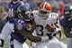 Sep 15, 2013; Baltimore, MD, USA; Cleveland Browns running back Trent Richardson (33) tackled by Baltimore Ravens linebacker Pernell McPhee (90) at M&T Bank Stadium. Mandatory Credit: Mitch Stringer-USA TODAY Sports