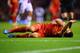 LIVERPOOL, ENGLAND - JANUARY 18: Luis Suarez of Liverpool lies injured during the Barclays Premier League match between Liverpool and Aston Villa at Anfield on January 18, 2014 in Liverpool, England. (Photo by Michael Regan/Getty Images)