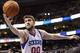 Feb 7, 2014; Philadelphia, PA, USA; Philadelphia 76ers center Spencer Hawes (00) grabs a rebound during the second quarter against the Los Angeles Lakers at the Wells Fargo Center. The Lakers defeated the Sixers 112-98. Mandatory Credit: Howard Smith-USA