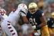 SOUTH BEND, IN - AUGUST 31: Sheldon Day #91 of the Notre Dame Fighting Irish rushes against Zach Hooks #54 of the Temple Owls at Notre Dame Stadium on August 31, 2013 in South Bend, Indiana. Notre Dame defeated Temple 28-6. (Photo by Jonathan Daniel/Get