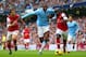 MANCHESTER, ENGLAND - DECEMBER 14: Yaya Toure of Manchester City is closed down by Mathieu Flamini and Bacary Sagna of Arsenal during the Barclays Premier League match between Manchester City and Arsenal at Etihad Stadium on December 14, 2013 in Manches