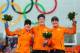 SOCHI, RUSSIA - FEBRUARY 16: (L-R) Silver medalist Ireen Wust of the Netherlands, gold medalist Jorien ter Mors of the Netherlands and bronze medalist Lotte van Beek of the Netherlands on the podium during the flower ceremony for the Speed Skating Women'