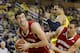 Frank Kaminsky's 25 points and 11 rebounds pushed the Badgers to a 75-62 win over UM.