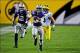 Dec 28, 2013; Tempe, AZ, USA; Kansas State Wildcats defensive back Carl Miles Jr. (2) returns an interception 51 yards as defensive back Ty Zimmerman (12) blocks and Michigan Wolverines wide receiver Drew Dileo (9) defends during the second half in the Bu