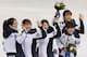 The South Korean team in jubilant mood following the flower ceremony.