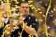 NEW ORLEANS, LA - JANUARY 03: Head coach Brady Hoke of the Michigan Wolverines celebrates with the trophy after Michigan won 23-20 in overtime against the Virginia Tech Hokies during the Allstate Sugar Bowl at Mercedes-Benz Superdome on January 3, 2012 i