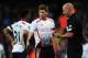 LONDON, ENGLAND - FEBRUARY 16: Raheem Sterling (L) and Steven Gerrard (C) of Liverpool talk with match referee Howard Webb during the FA Cup Fifth Round match between Arsenal and Liverpool at the Emirates Stadium on February 16, 2014 in London, England.