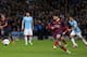 MANCHESTER, ENGLAND - FEBRUARY 18: Lionel Messi of Barcelona scores the opening goal from a penalty kick during the UEFA Champions League Round of 16 first leg match between Manchester City and Barcelona at the Etihad Stadium on February 18, 2014 in Manc
