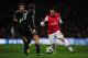 LONDON, ENGLAND - FEBRUARY 19: Santi Cazorla of Arsenal in action against Philipp Lahm of Bayern Muenchen during the UEFA Champions League round of 16 first leg match between Arsenal and Bayern Muenchen at Emirates Stadium on February 19, 2013 in London,