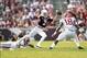 Sep 14, 2013; College Station, TX, USA; Texas A&M Aggies quarterback Johnny Manziel (2) scrambles from Alabama Crimson Tide linebacker Reggie Ragland (18) and linebacker Trey DePriest (33) during the second half at Kyle Field. Mandatory Credit: Thomas Cam