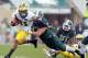 Nov 2, 2013; East Lansing, MI, USA; Michigan Wolverines wide receiver Jeremy Gallon (21) runs for yards after the catch against Michigan State Spartans defensive end Marcus Rush (44) during the 1st quarter of a game at Spartan Stadium. Mandatory Credit: M