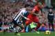 LIVERPOOL, ENGLAND - OCTOBER 26: Glen Johnson of Liverpool competes with Liam Ridgewell of West Bromwich Albion during the Barclays Premier League match between Liverpool and West Bromwich Albion at Anfield on October 26, 2013 in Liverpool, England. (Ph