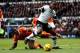 DERBY, ENGLAND - DECEMBER 07: Andre Wisdom of Derby holds off the challenge of Tyler Blackett of Blackpool during the Sky Bet Championship match between Derby County and Blackpool at iPro Stadium on December 07, 2013 in Derby, England. (Photo by Ben Hoski