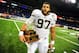 Dec 26, 2013; Detroit, MI, USA; Pittsburgh Panthers defensive lineman Aaron Donald (97) holds the lineman of the game trophy after defeating Bowling Green Falcons 30-27 to win the Little Caesars Pizza Bowl at Ford Field. Mandatory Credit: Andrew Weber-USA