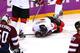 SOCHI, RUSSIA - FEBRUARY 19: Patrick Sharp #10 and Rick Nash #61 of Canada check on teammate John Tavares #20 after he was injured during the Men's Ice Hockey Quarterfinal Playoff against Latvia on Day 12 of the 2014 Sochi Winter Olympics at Bolshoy Ice