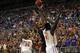 Feb 19, 2014; Gainesville, FL, USA; Auburn Tigers guard Chris Denson (3) shoots over Florida Gators center Patric Young (4) during the first half at Stephen C. O'Connell Center. Mandatory Credit: Kim Klement-USA TODAY Sports