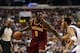 Feb 18, 2014; Philadelphia, PA, USA; Cleveland Cavaliers forward Luol Deng (9) is defended by Philadelphia 76ers guard Evan Turner (12) during the first quarter at the Wells Fargo Center. The Cavaliers defeated the Sixers 114-85. Mandatory Credit: Howard