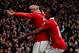 MANCHESTER, ENGLAND - FEBRUARY 12: Wayne Rooney of Manchester United celebrates with teammate Nani (R) after he scores a goal from an overhead kick during the Barclays Premier League match between Manchester United and Manchester City at Old Trafford on