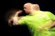 LONDON, ENGLAND - MAY 16: Michael Van Gerwen of Holland in action during his semi final match against James Wades of England during the McCoy's Premier League Darts Play-Offs at The O2 Arena on May 16, 2013 in London, England. (Photo by Charlie Crowhurst/
