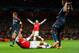 LONDON, ENGLAND - FEBRUARY 19: Jerome Boateng of Bayern Muenchen brings down Mesut Oezil of Arsenal in the area for a penalty during the UEFA Champions League Round of 16 first leg match between Arsenal and FC Bayern Muenchen at Emirates Stadium on Febru