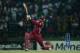 KANDY, SRI LANKA - OCTOBER 01: Chris Gayle of West Indies hits out for six during the superover of the ICC World Twenty20 2012 Super Eights Group 1 match between the West Indies and New Zealand at Pallekele Cricket Stadium on October 1, 2012 in Kandy, Sr