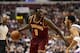 Feb 18, 2014; Philadelphia, PA, USA; Cleveland Cavaliers forward Luol Deng (9) is defended by Philadelphia 76ers guard Evan Turner (12) during the first quarter at the Wells Fargo Center. Mandatory Credit: Howard Smith-USA TODAY Sports