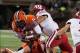 Oct 19, 2013; Champaign, IL, USA; Illinois Fighting Illini quarterback Aaron Bailey (15) is tackled by Wisconsin Badgers linebacker Marcus Trotter (59) during the third quarter at Memorial Stadium. Wisconsin wins 56-32 over Illinois. Mandatory Credit: Tr