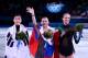 SOCHI, RUSSIA - FEBRUARY 20: (L-R) Silver medalist Yuna Kim of South Korea, gold medalist Adelina Sotnikova of Russia and bronze medalist Carolina Kostner of Italy celebrate during the flower ceremony for the Ladies' Figure Skating on day 13 of the Sochi