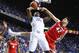 LEXINGTON, KY - JANUARY 25: Julius Randle #30 of the Kentucky Wildcats shoots the ball while defended by Nemanja Djurisic #42 of the Georgia Bulldogs during the game at Rupp Arena on January 25, 2014 in Lexington, Kentucky. (Photo by Andy Lyons/Getty Im