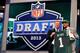 NEW YORK, NY - APRIL 25: Dee Milliner (R) of the Alabama Crimson Tide stands with NFL Commissioner Roger Goodell as they hold up a jersey on stage after Milliner was picked #9 overall by the New York Jets in the first round of the 2013 NFL Draft at Radio