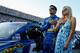 DAYTONA BEACH, FL - JULY 06: Martin Truex Jr., driver of the #56 NAPA Batteries Toyota, stands on the grid with his girlfriend Sherry Pollex prior to the NASCAR Sprint Cup Series Coke Zero 400 at Daytona International Speedway on July 6, 2013 in Daytona B