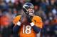 Jan 12, 2014; Denver, CO, USA; Denver Broncos quarterback Peyton Manning (18) throws against the San Diego Chargers during the 2013 AFC divisional playoff football game at Sports Authority Field at Mile High. Mandatory Credit: Matthew Emmons-USA TODAY Spo