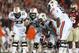 Jan 6, 2014; Pasadena, CA, USA; Auburn Tigers guard Alex Kozan (63) tries to hear the play call while in the huddle with tackle Greg Robinson (73) center Reese Dismukes (50) and tackle Avery Young (56) against the Florida State Seminoles during the second